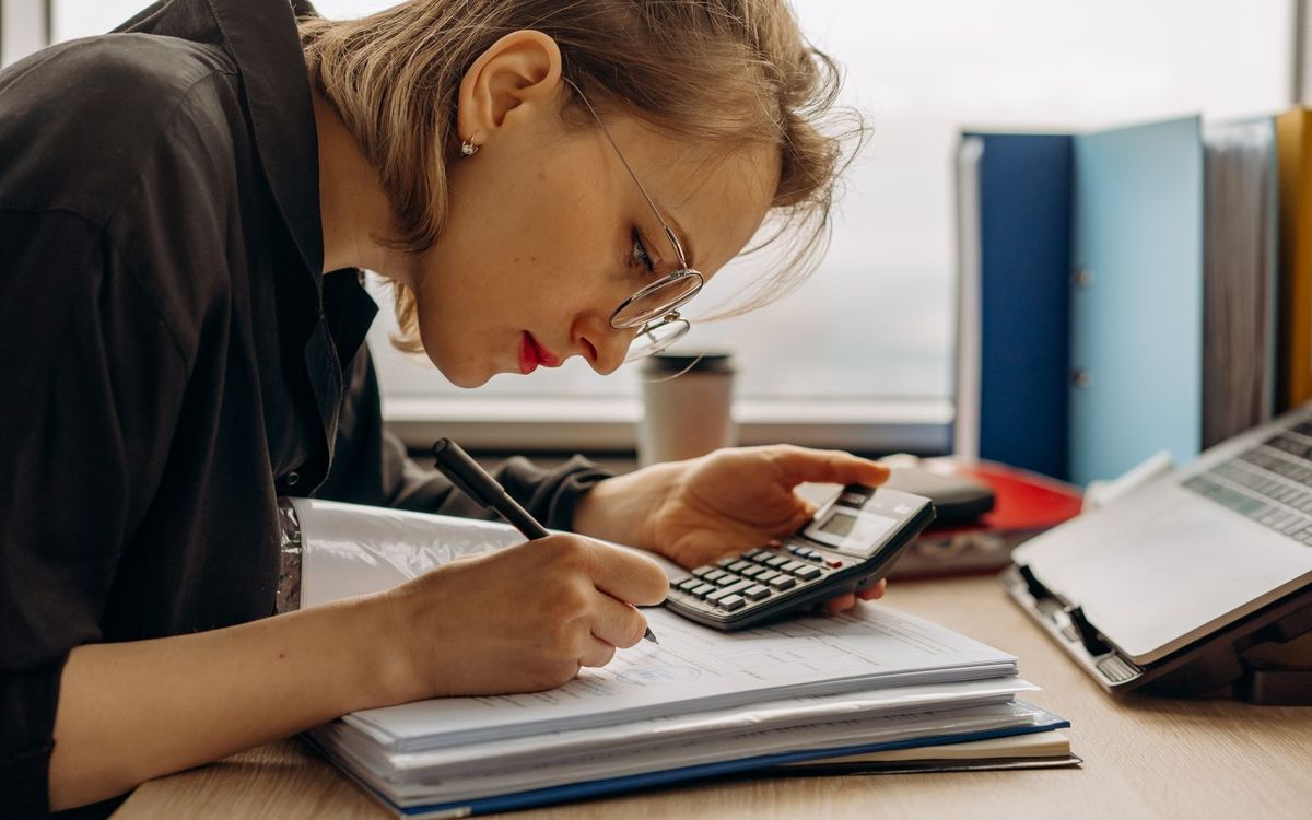 A tax agent working through paperwork